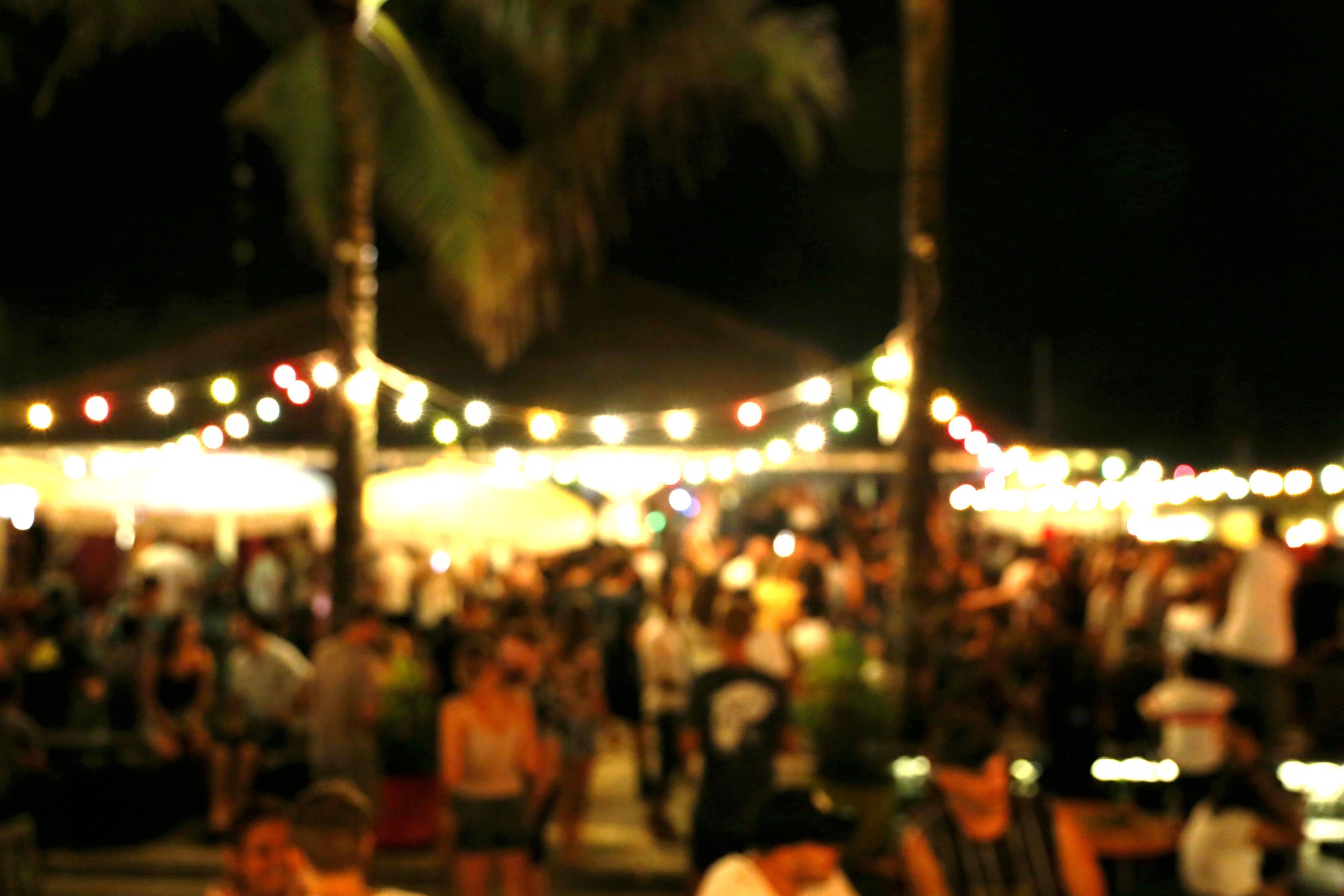 Blurred background of many people had fun at a beach party